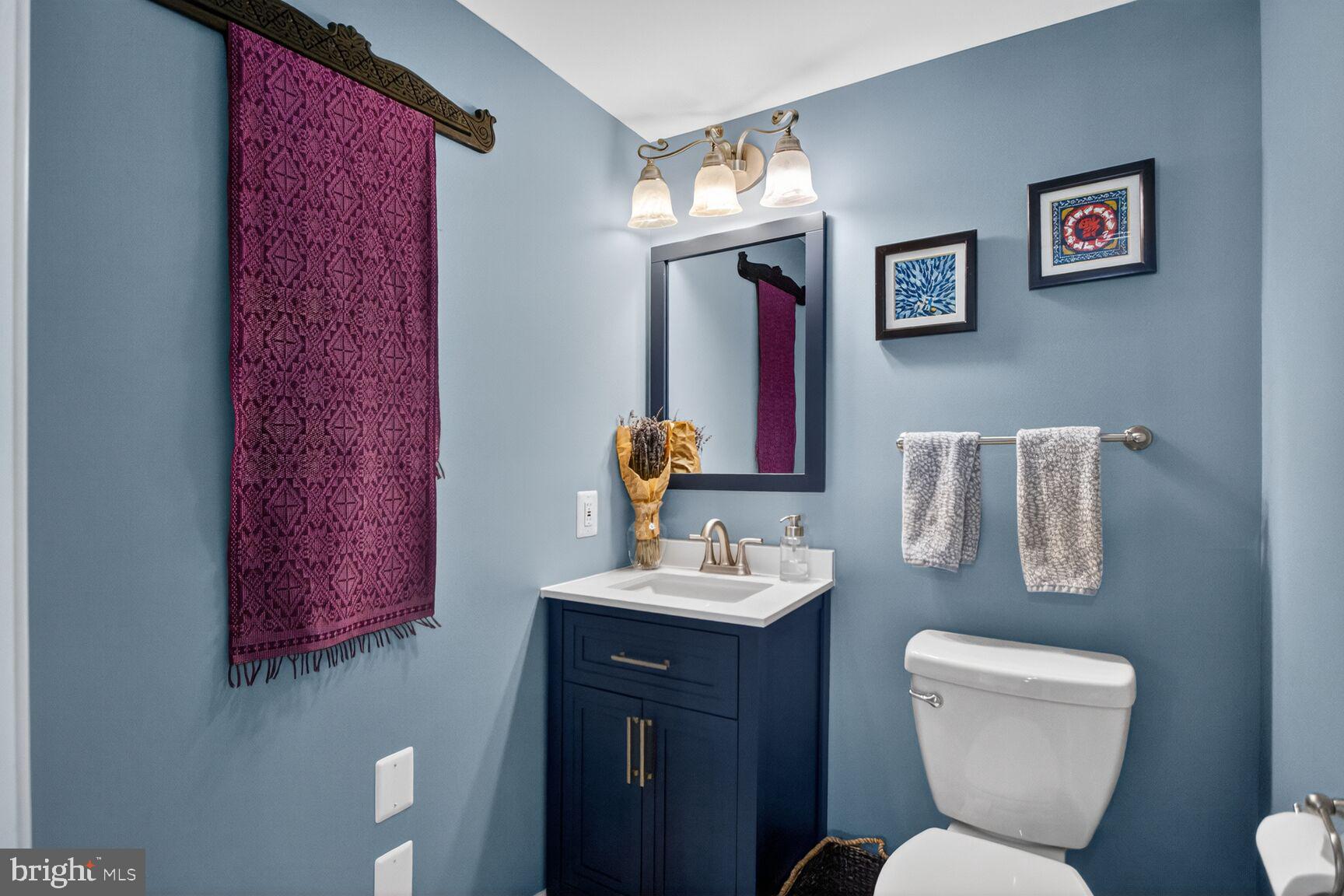 7007 Lemay Road Rockville, MD 20851 - Photo 14 of 37 a bathroom with a toilet sink and mirror