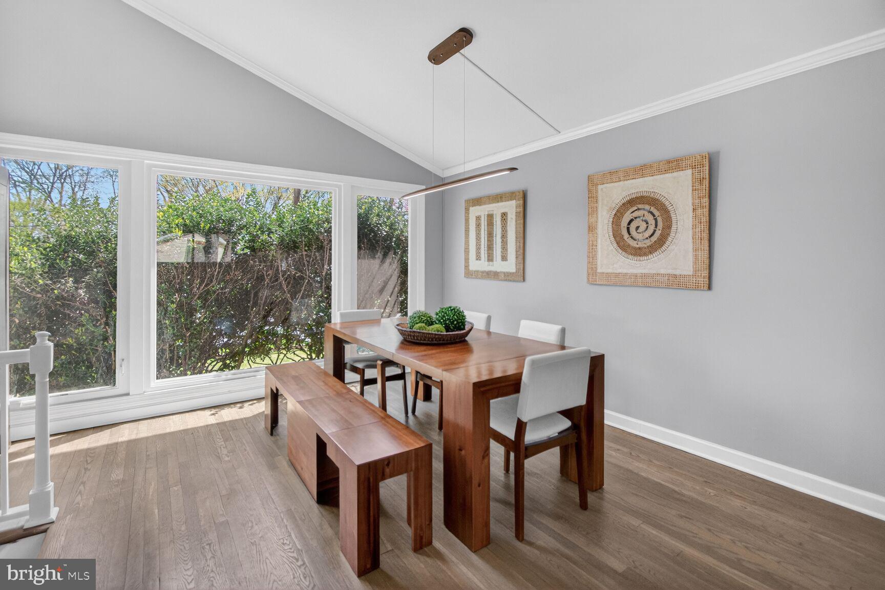 7007 Lemay Road Rockville, MD 20851 - Photo 18 of 37 a view of a dining room with furniture window and wooden floor