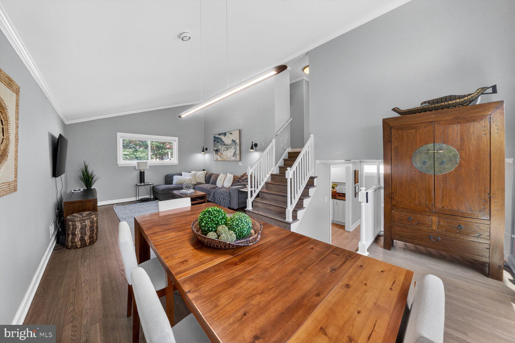 7007 Lemay Road Rockville, MD 20851 - Photo 21 of 37 a living room with furniture dining table and wooden floor