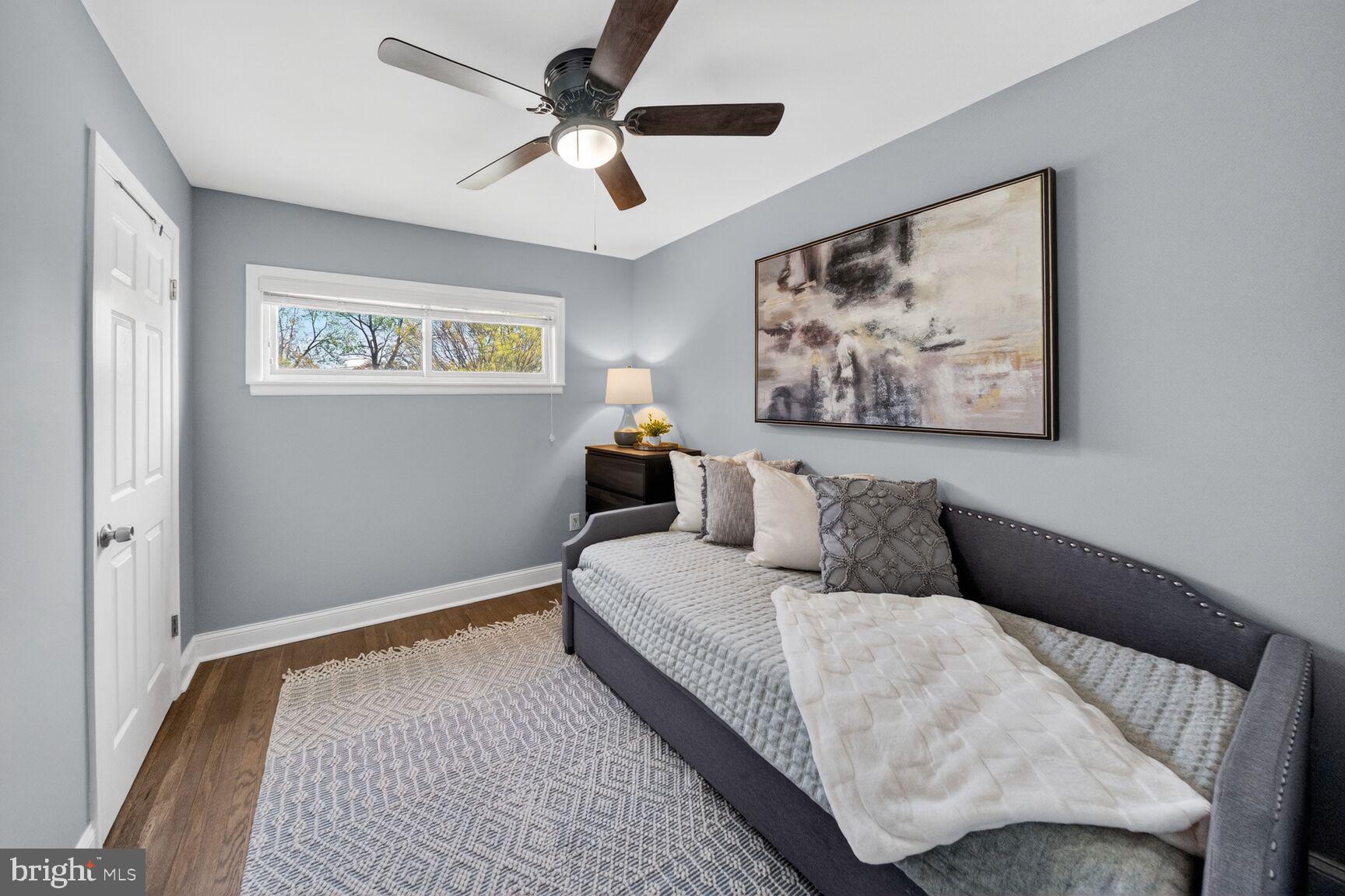 7007 Lemay Road Rockville, MD 20851 - Photo 23 of 37 a bedroom with a bed and a painting on the wall