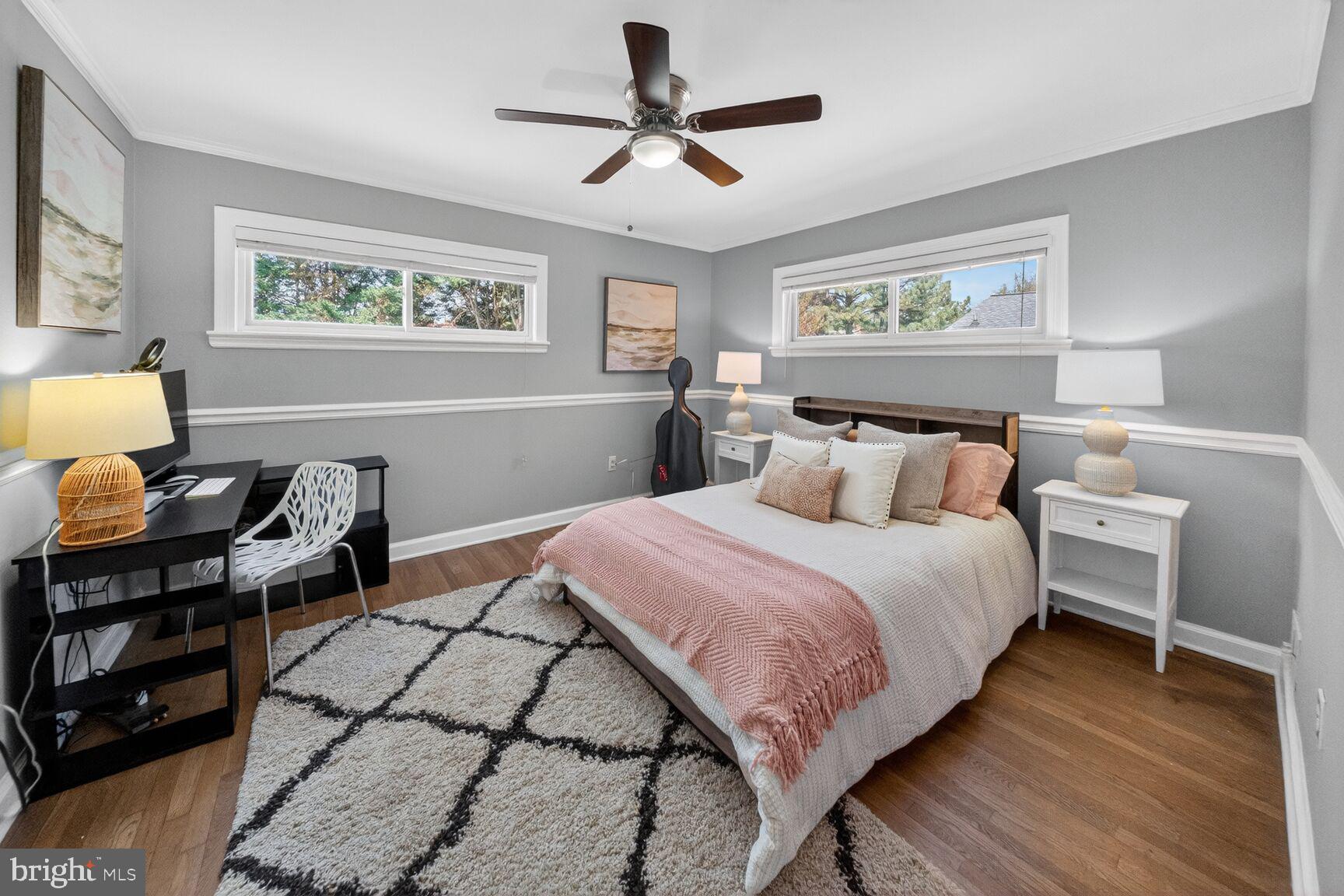 7007 Lemay Road Rockville, MD 20851 - Photo 26 of 37 a bedroom with a bed and wooden floor