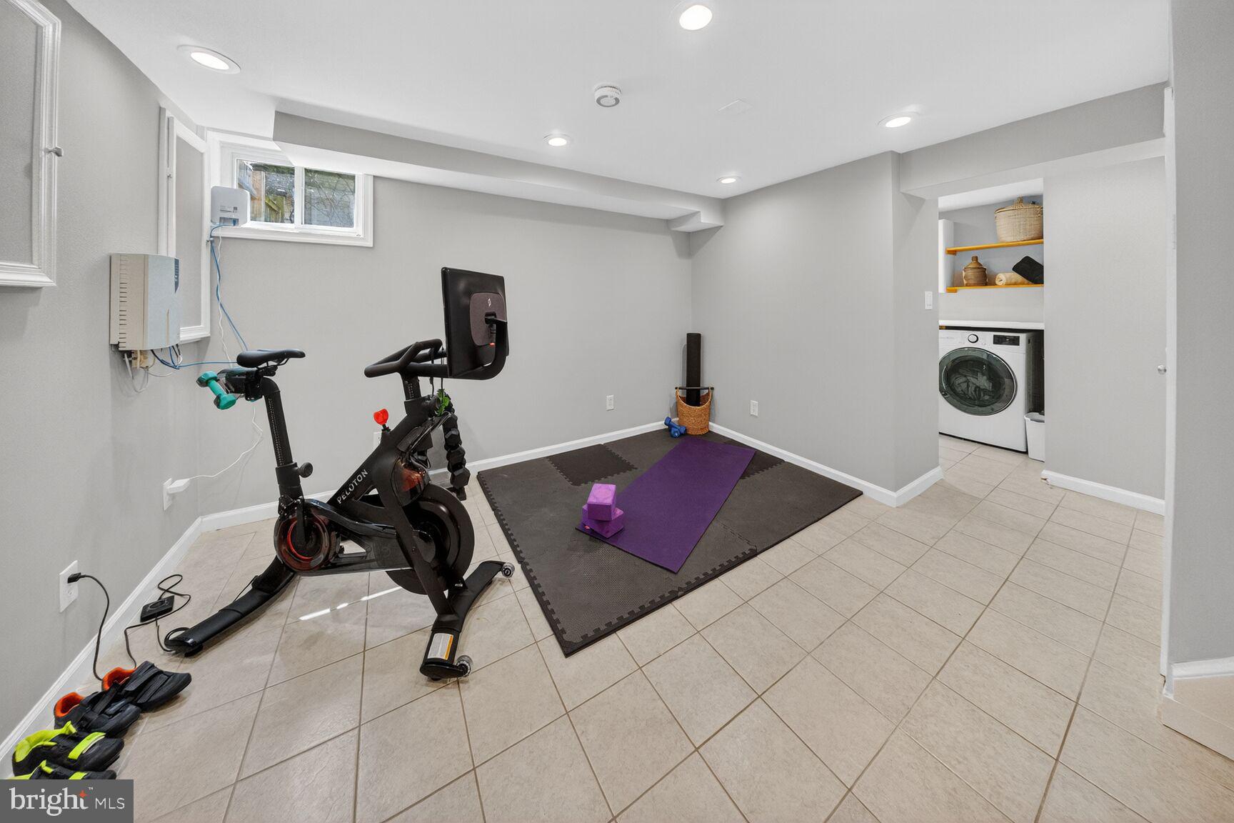 7007 Lemay Road Rockville, MD 20851 - Photo 30 of 37 a room with gym equipment and view of living room