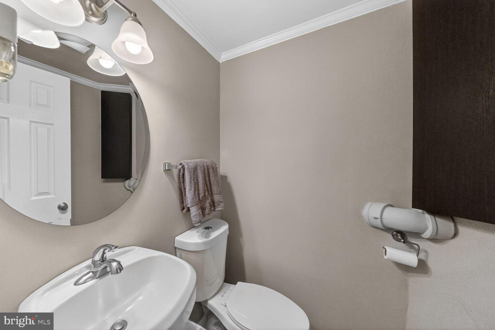 7007 Lemay Road Rockville, MD 20851 - Photo 32 of 37 a bathroom with a toilet sink and mirror