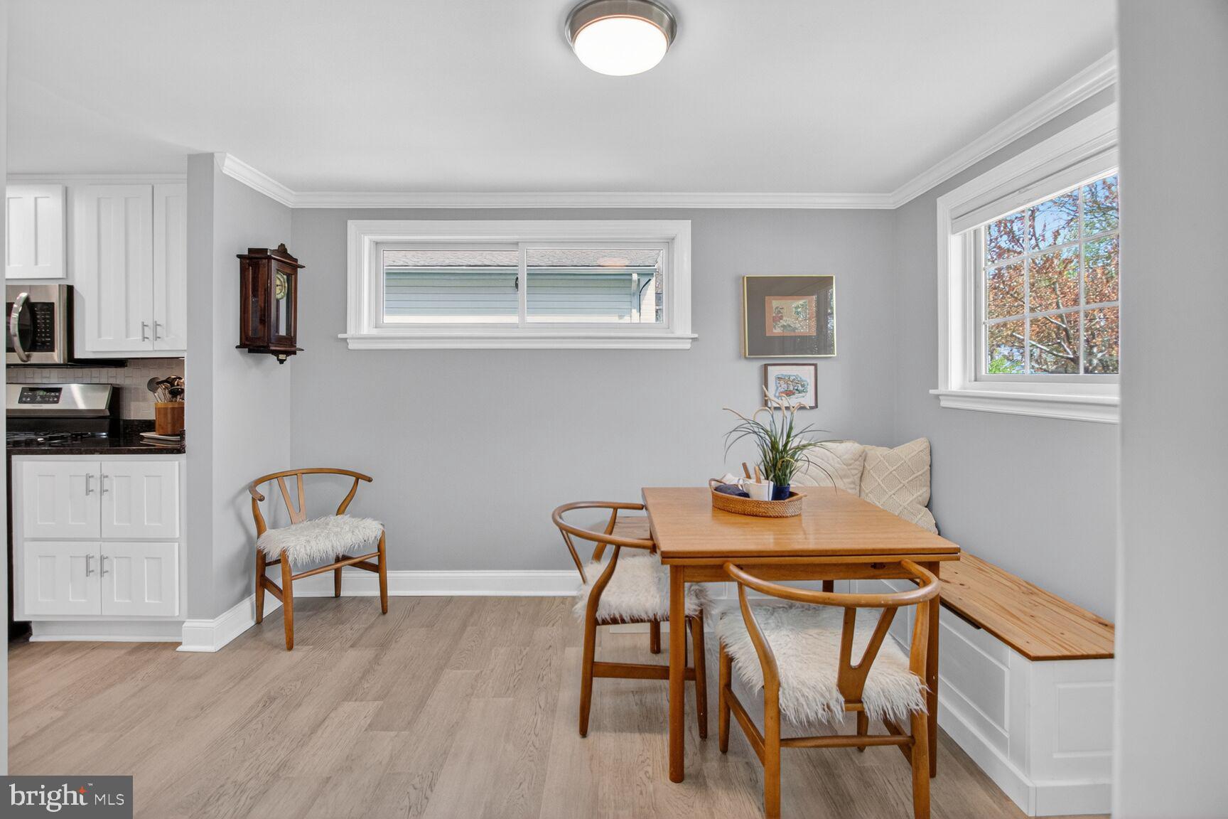 7007 Lemay Road Rockville, MD 20851 - Photo 9 of 37 a view of a dining room with furniture and wooden floor