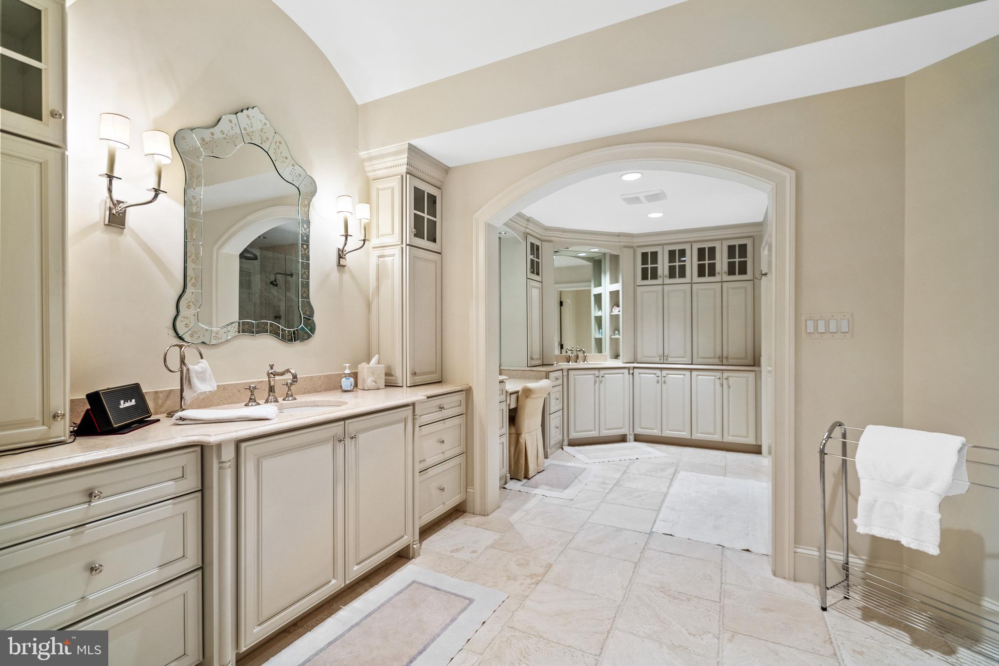 1160 Chain Bridge Road McLean, VA 22101 - Photo 34 of 57 The primary bath is finished in timeless limestone