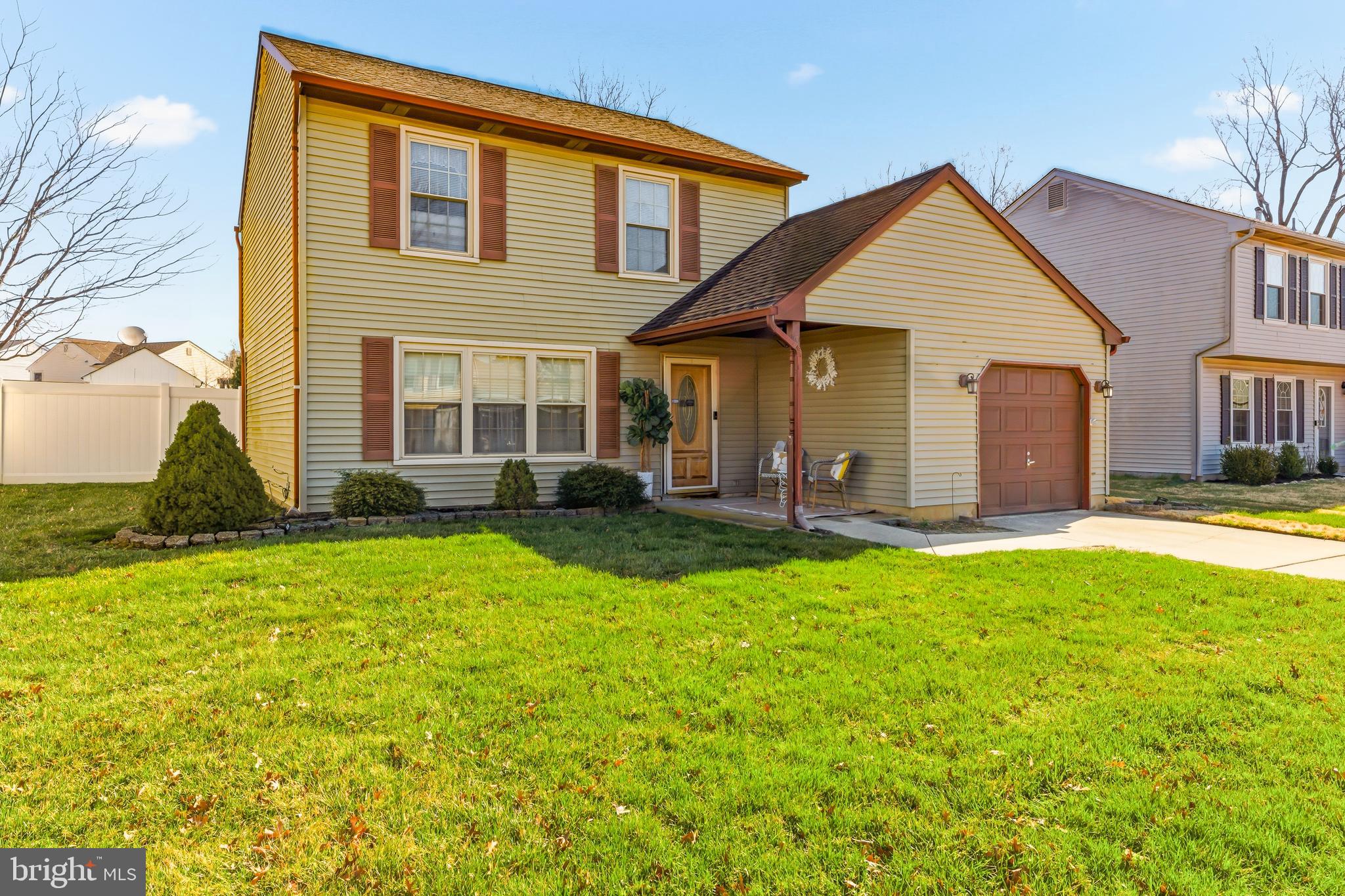119 Robins Run West Swedesboro, NJ 08085 - Photo 1 of 20 a front view of house with yard and porch