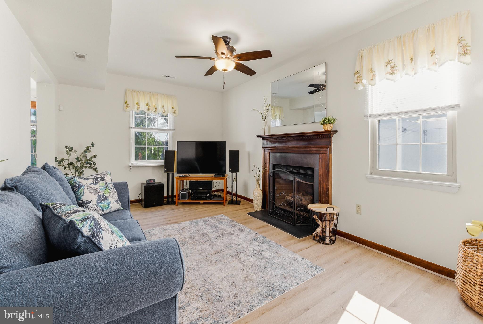 119 Robins Run West Swedesboro, NJ 08085 - Photo 11 of 20 a living room with furniture and a fireplace