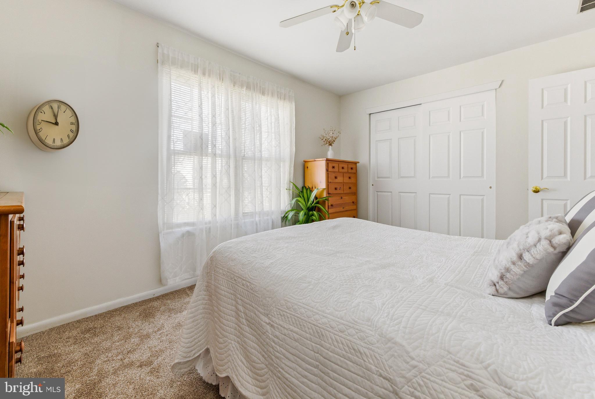 119 Robins Run West Swedesboro, NJ 08085 - Photo 15 of 20 a bedroom with a bed and a chandelier