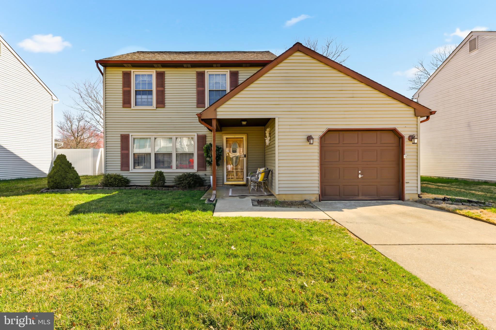 119 Robins Run West Swedesboro, NJ 08085 - Photo 2 of 20 a front view of a house with a yard