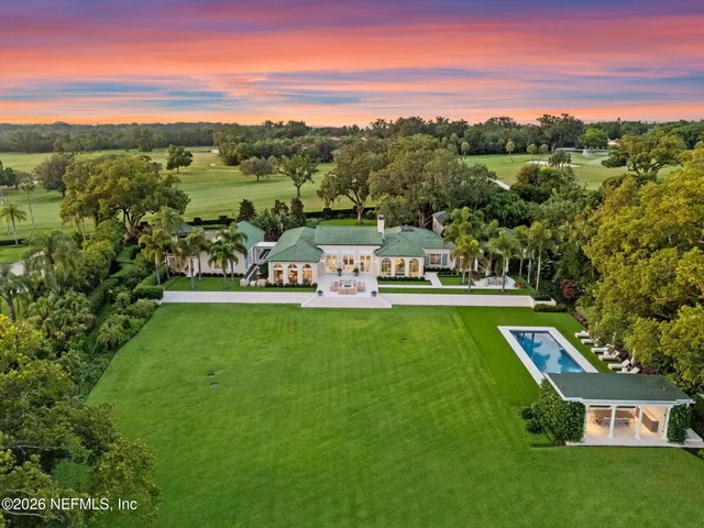 an aerial view of a house with mountain view
