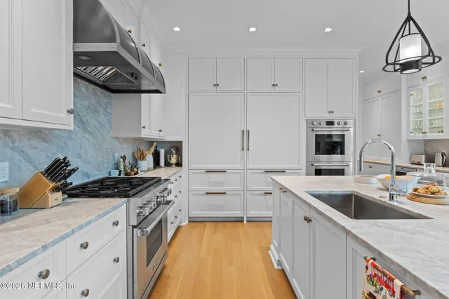a bathroom with a granite countertop sink mirror and double