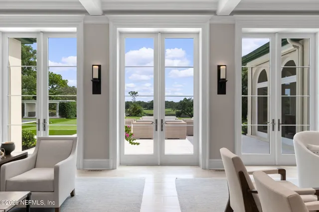 a bathroom with a granite countertop sink a mirror and a shower