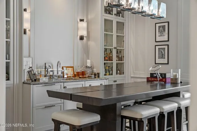 a spacious bedroom with a bed and a large window