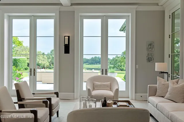 a view of a chair and table in the backyard