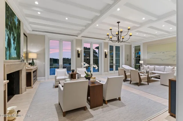 a view of a chair and table in the backyard