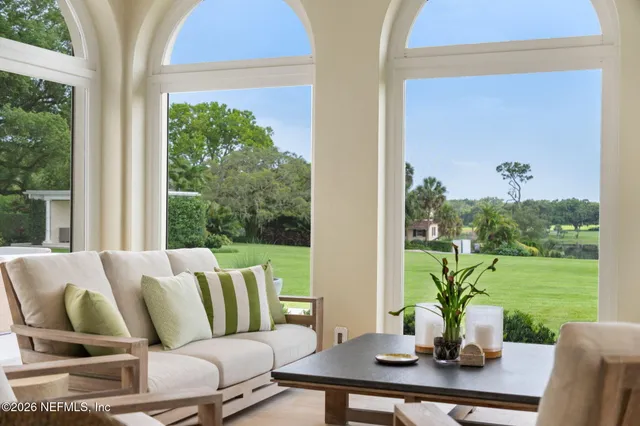 a view of a house with swimming pool and a yard