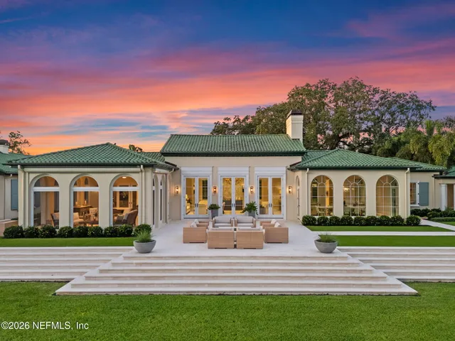a view of a livingroom with furniture and a window