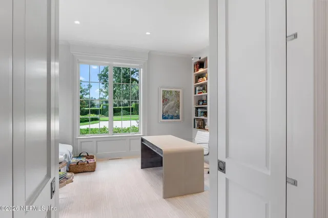 a view of a patio with couches and a table and chairs with garden view