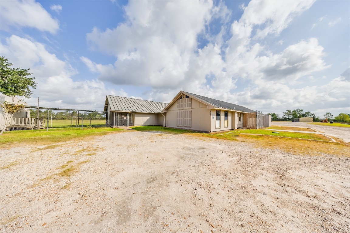 4227 Old Chocolate Bayou Road Manvel, TX 77578 - Photo 2 of 45 a view of a swimming pool with an outdoor space and seating area