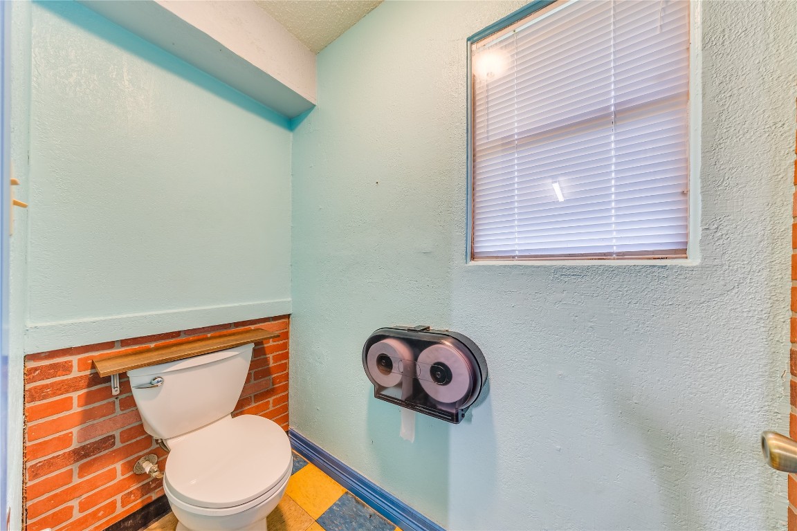 4227 Old Chocolate Bayou Road Manvel, TX 77578 - Photo 23 of 45 a bathroom with a toilet and a sink