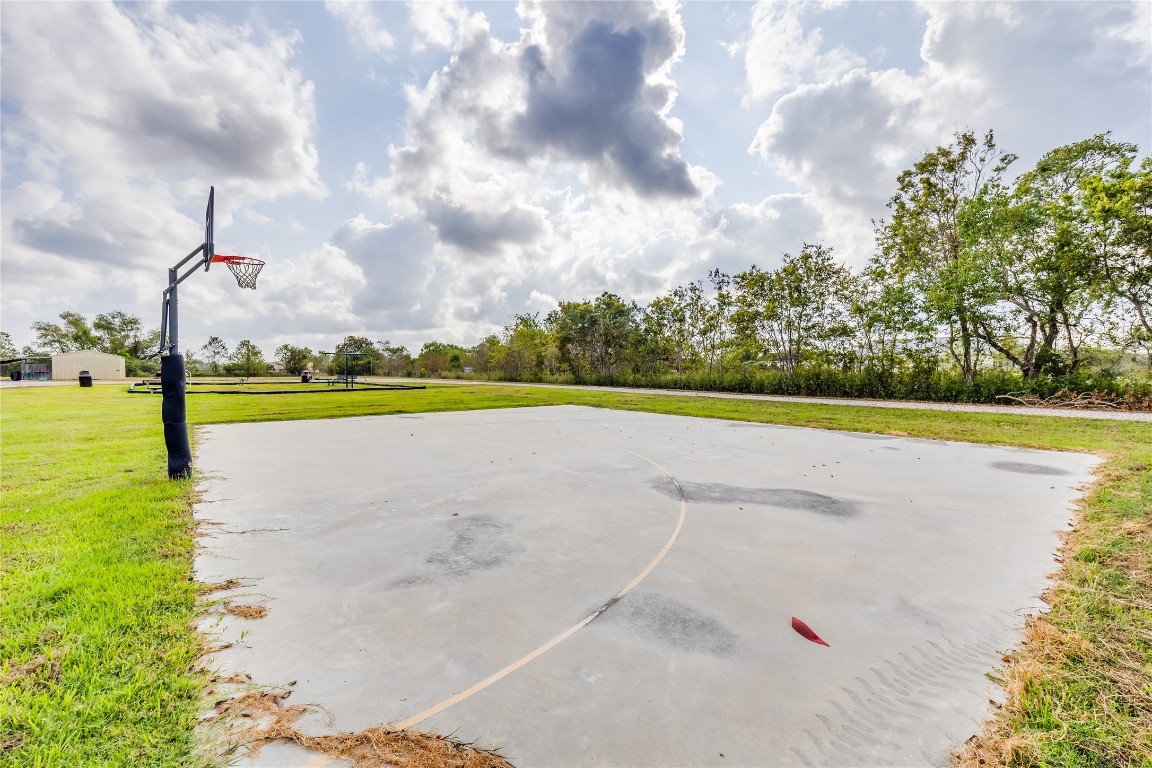 4227 Old Chocolate Bayou Road Manvel, TX 77578 - Photo 6 of 45 a view of a swimming pool and a yard