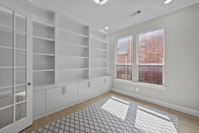 a bathroom with a sink mirror and toilet