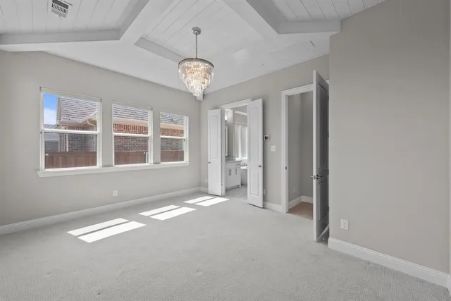 a view of an empty room and a window