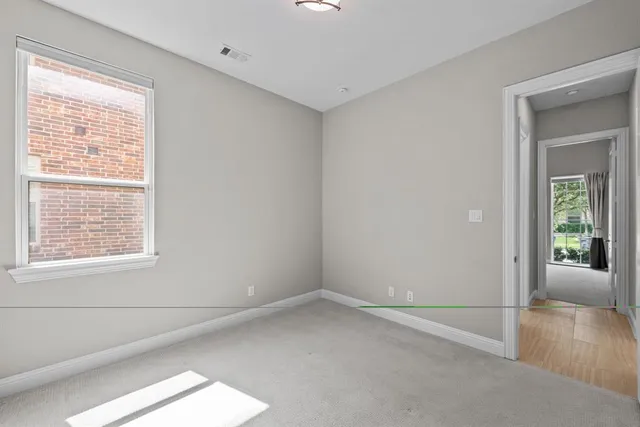 a view of an empty room and window