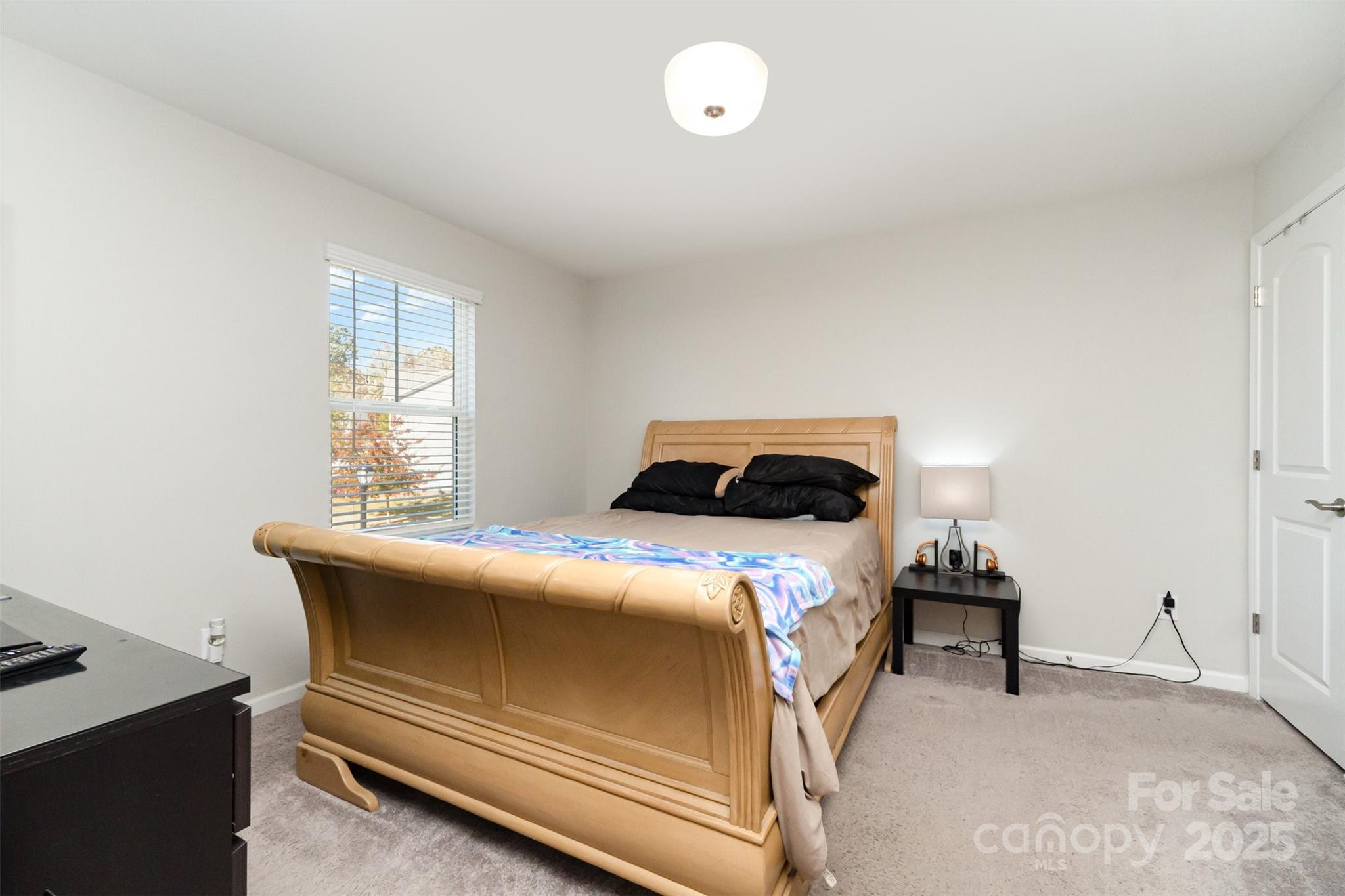 423 Crisfield Court York, SC 29745 - Photo 26 of 45 a bedroom with a bed and a window