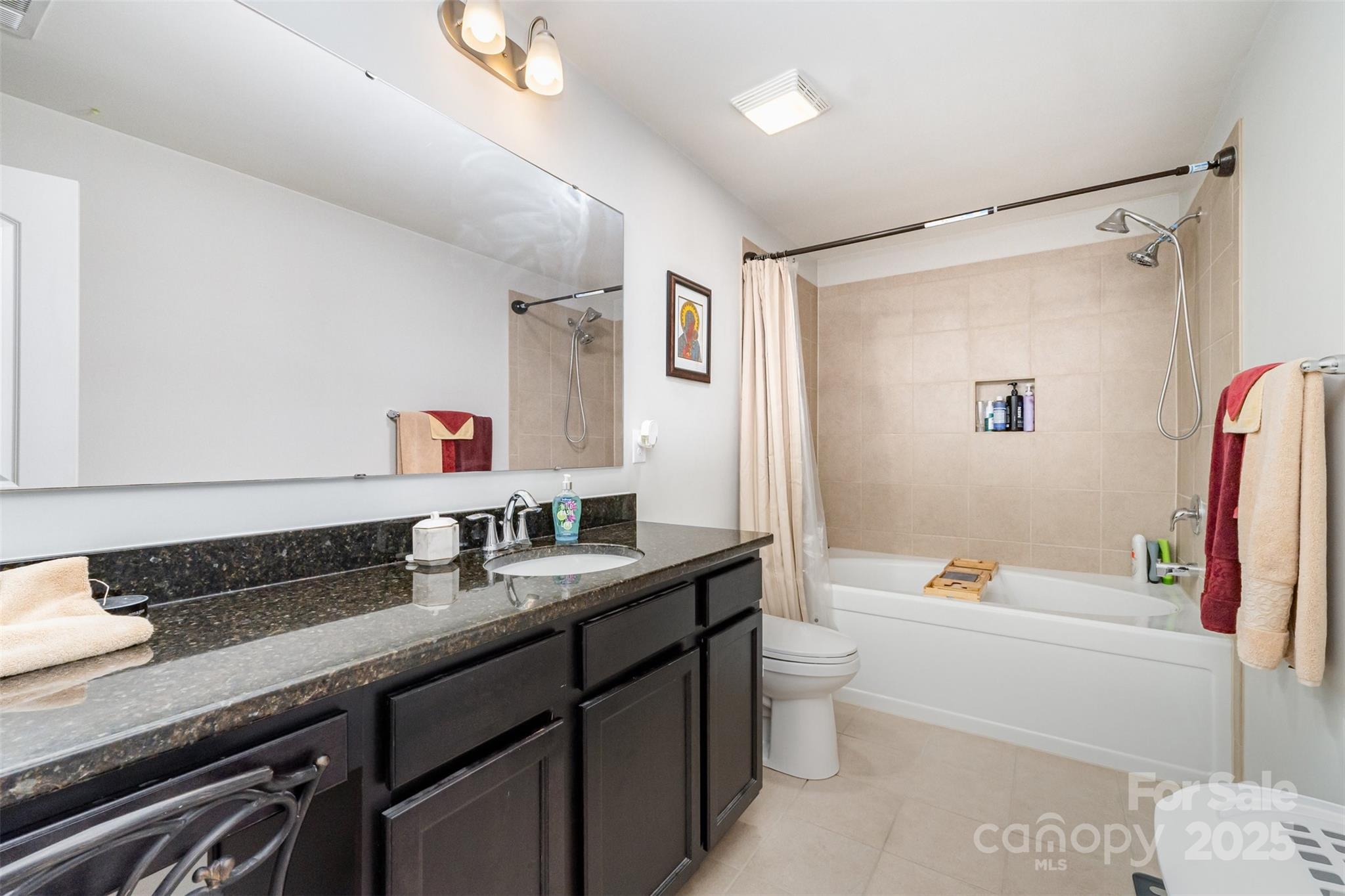 423 Crisfield Court York, SC 29745 - Photo 35 of 45 a bathroom with a granite countertop sink a toilet a shower and a mirror