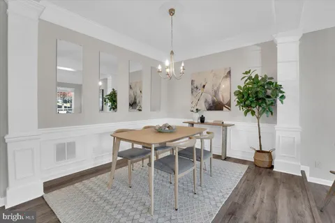 a view of a dining room with furniture and window
