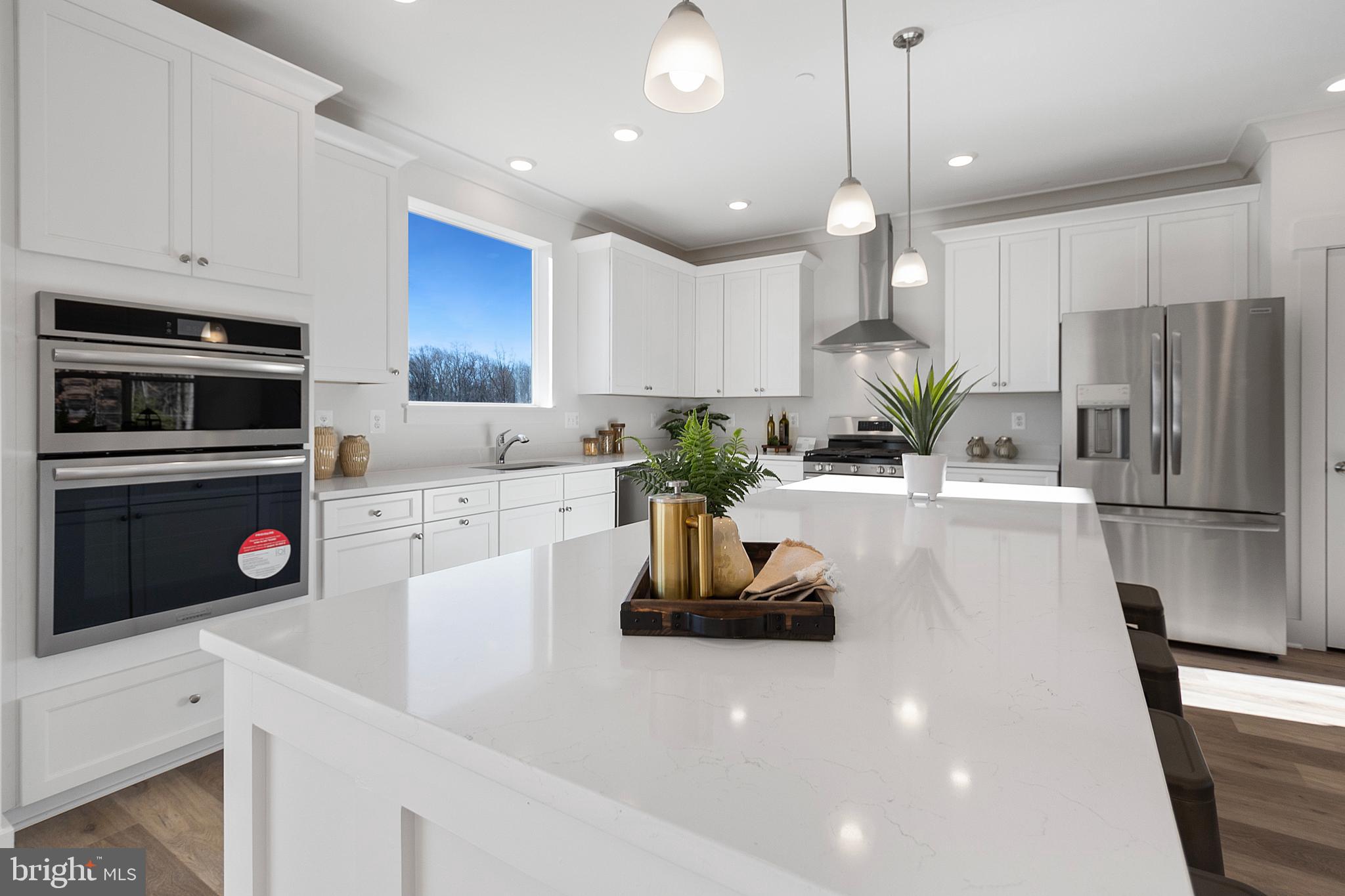 1333 German Driveway Hanover, MD 21076 - Photo 12 of 56 a kitchen with kitchen island a counter space cabinets stainless steel appliances and a counter space