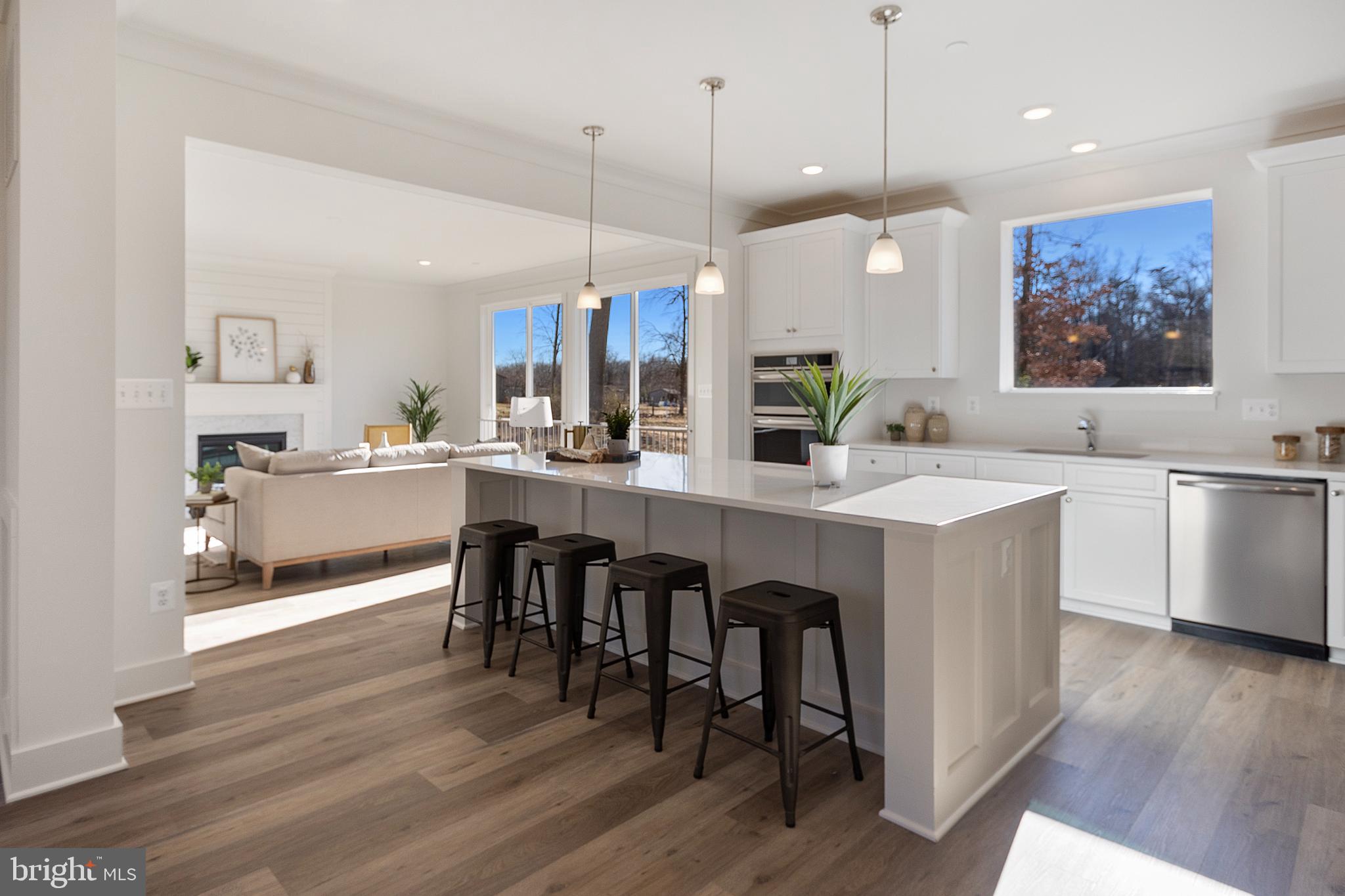1333 German Driveway Hanover, MD 21076 - Photo 15 of 56 a large kitchen with a table and chairs