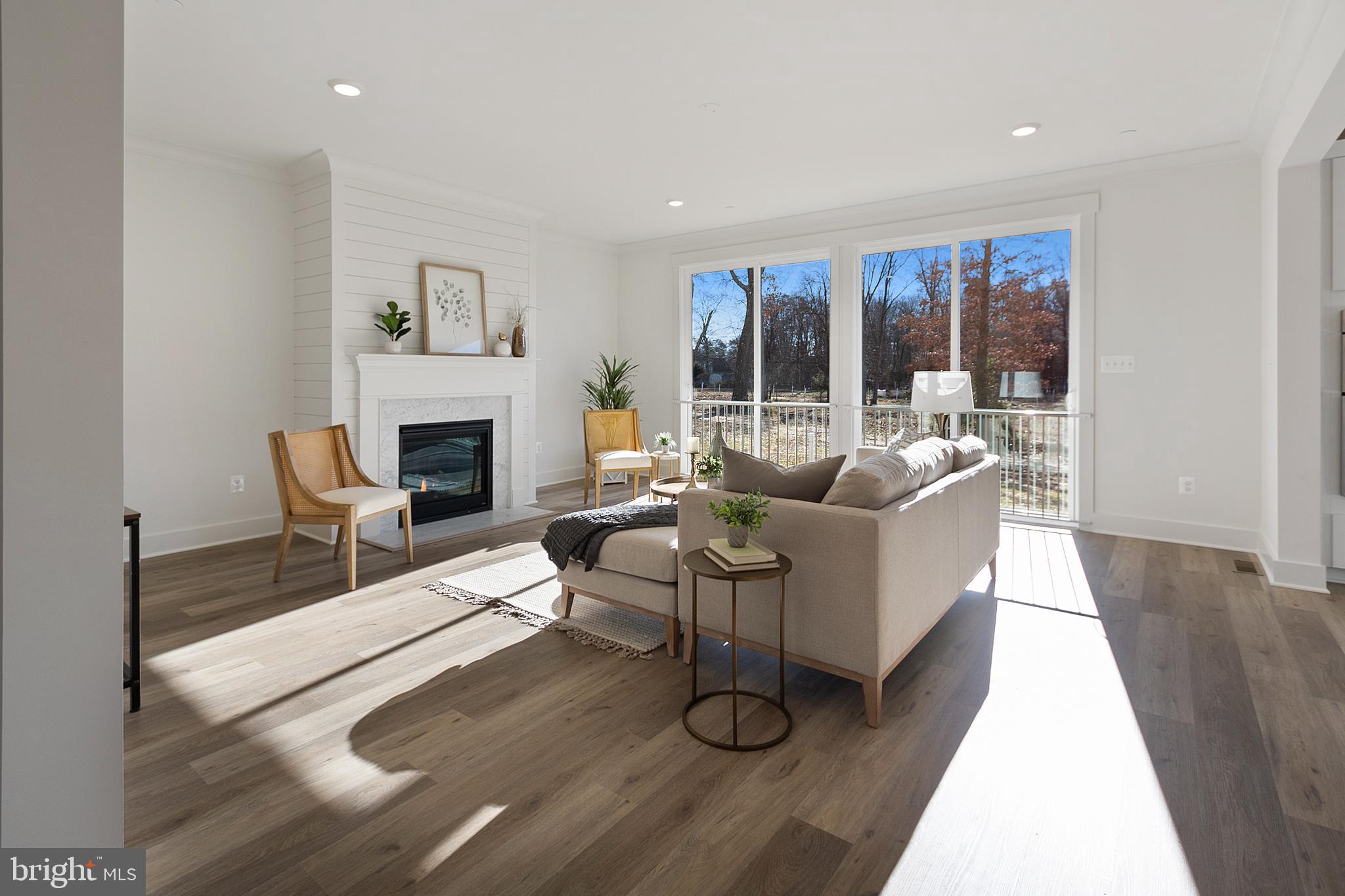 1333 German Driveway Hanover, MD 21076 - Photo 16 of 56 a living room with furniture and a fireplace