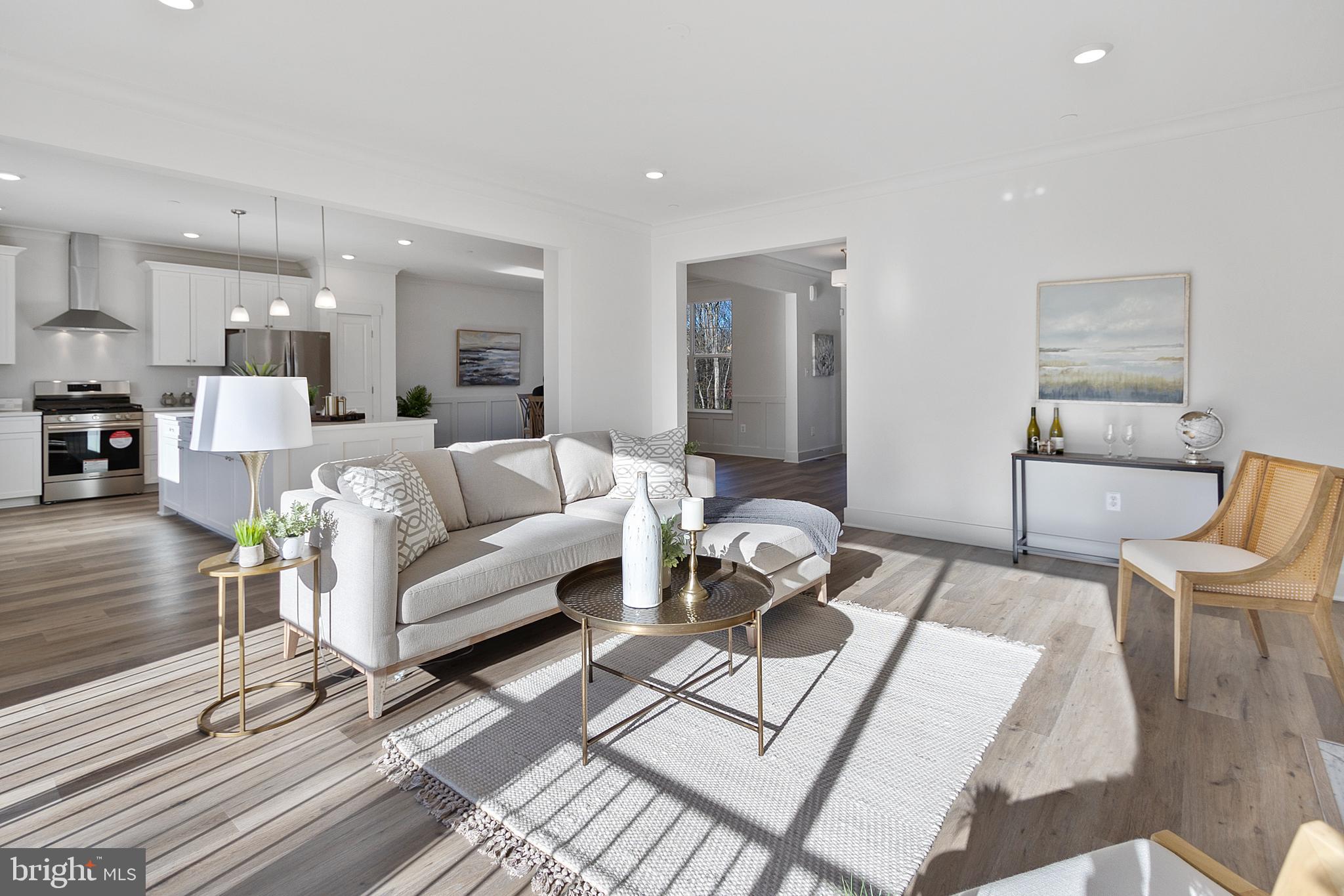1333 German Driveway Hanover, MD 21076 - Photo 19 of 56 a living room with furniture a rug and a view of kitchen