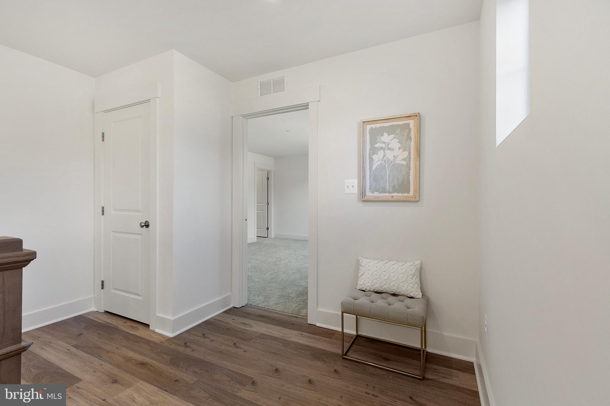 1333 German Driveway Hanover, MD 21076 - Photo 22 of 56 a room that has a chair and wooden floor