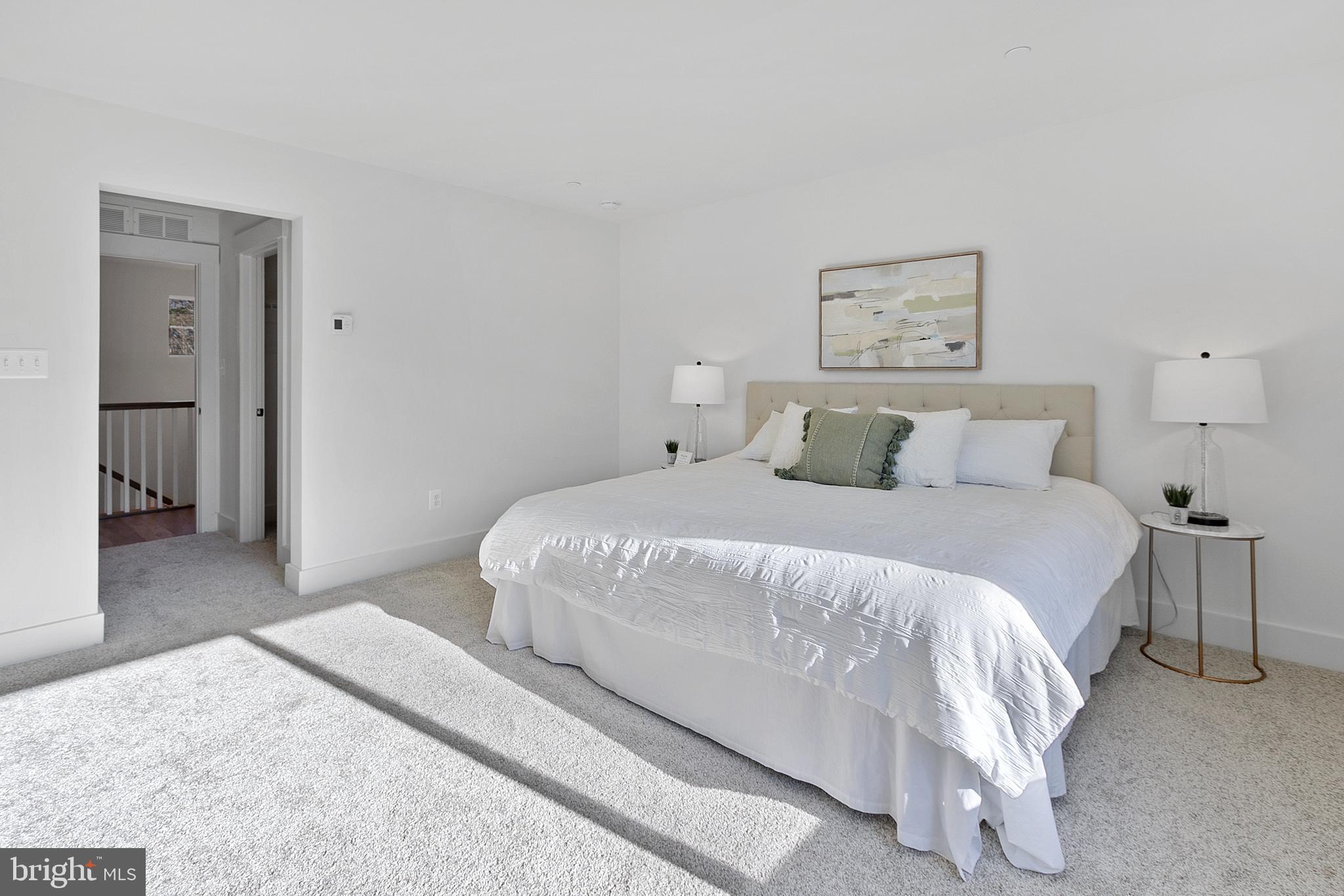 1333 German Driveway Hanover, MD 21076 - Photo 26 of 56 a bedroom with a bed and painting on the wall