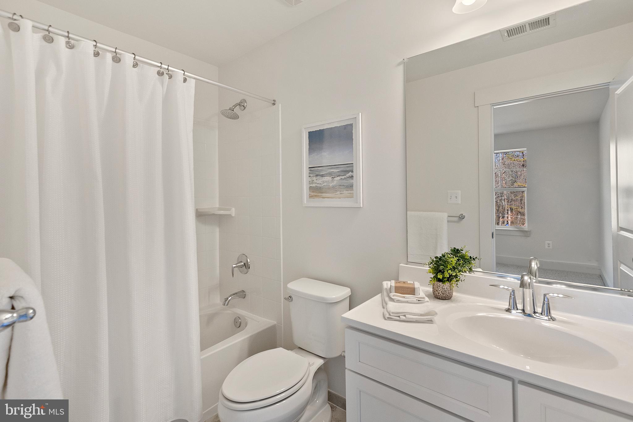 1333 German Driveway Hanover, MD 21076 - Photo 39 of 56 a bathroom with a sink a toilet and shower curtain