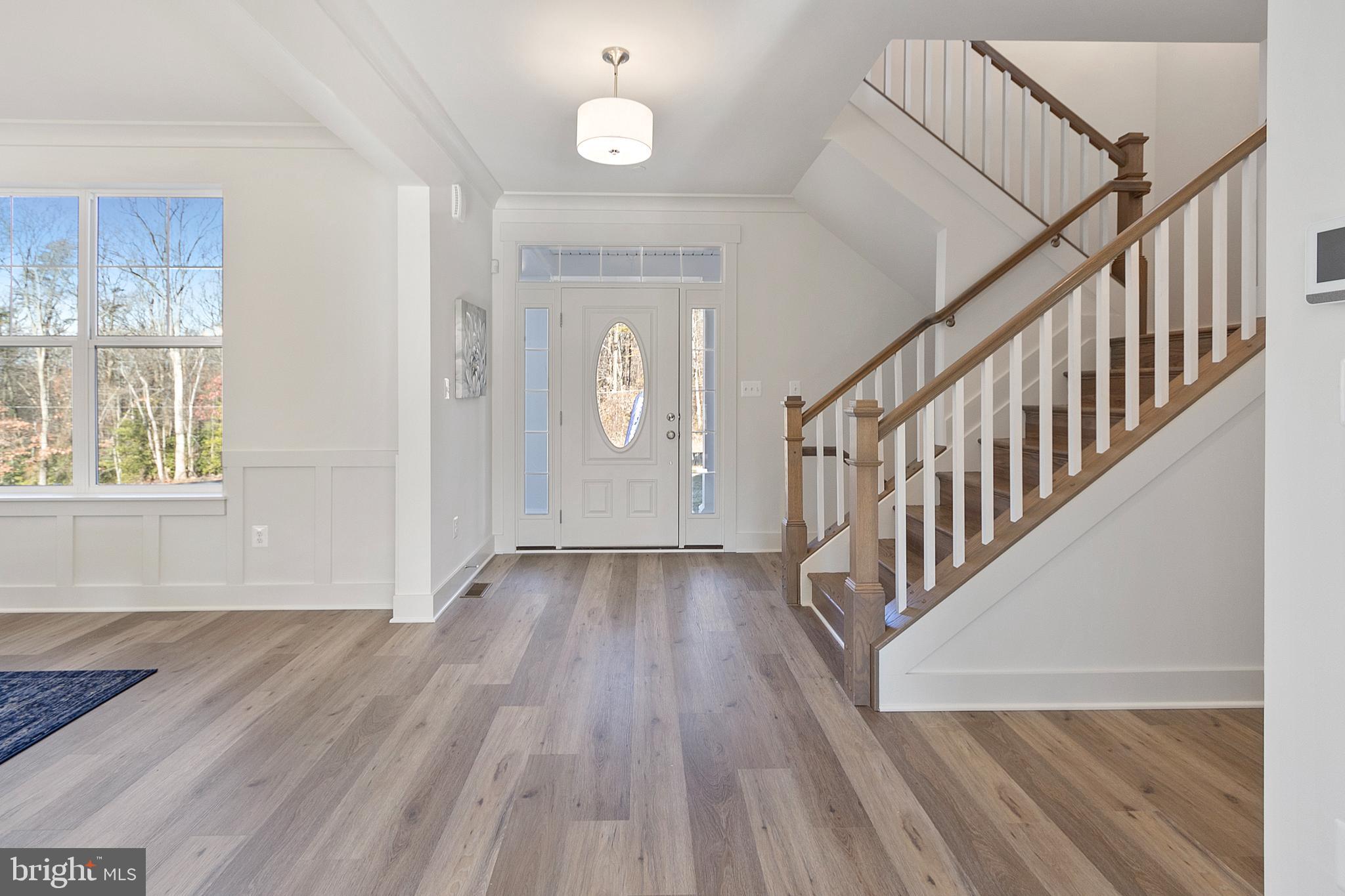 1333 German Driveway Hanover, MD 21076 - Photo 6 of 56 a view of hallway with wooden floor and stairs