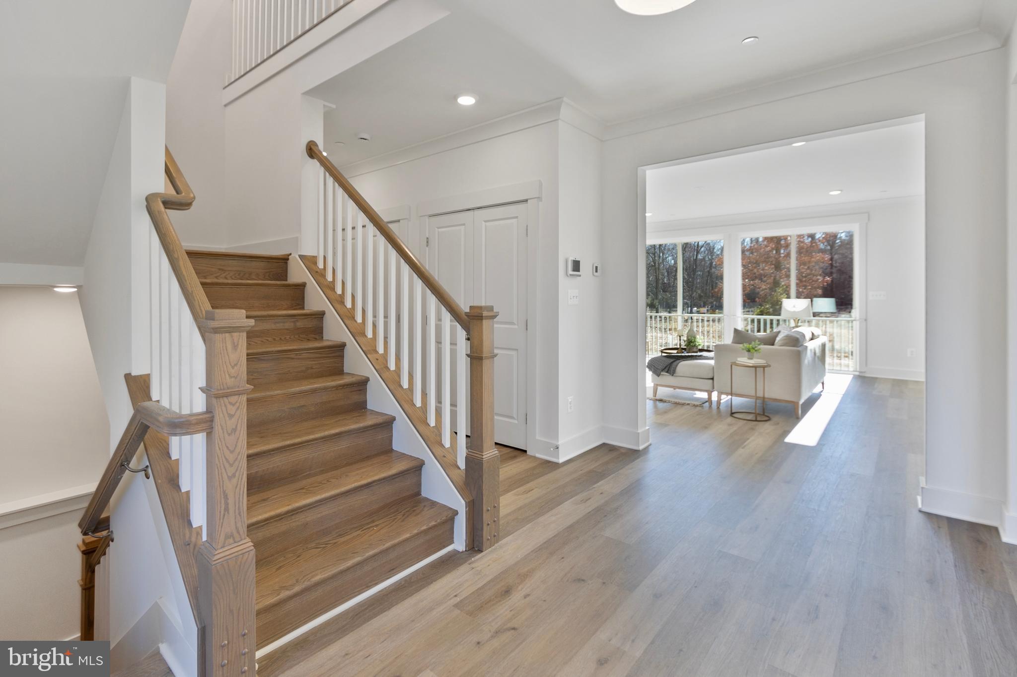 1333 German Driveway Hanover, MD 21076 - Photo 7 of 56 a view of a hallway with wooden floor and windows