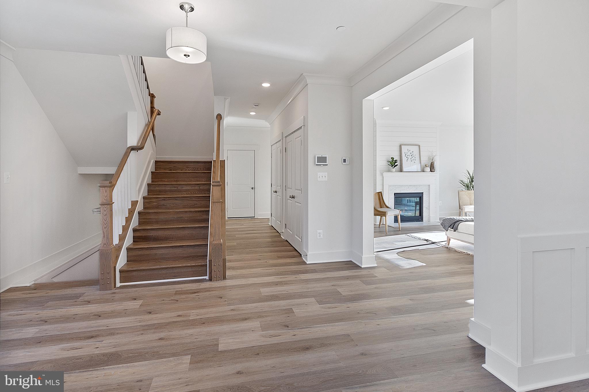 1333 German Driveway Hanover, MD 21076 - Photo 8 of 56 a view of a livingroom with wooden floor and stairs