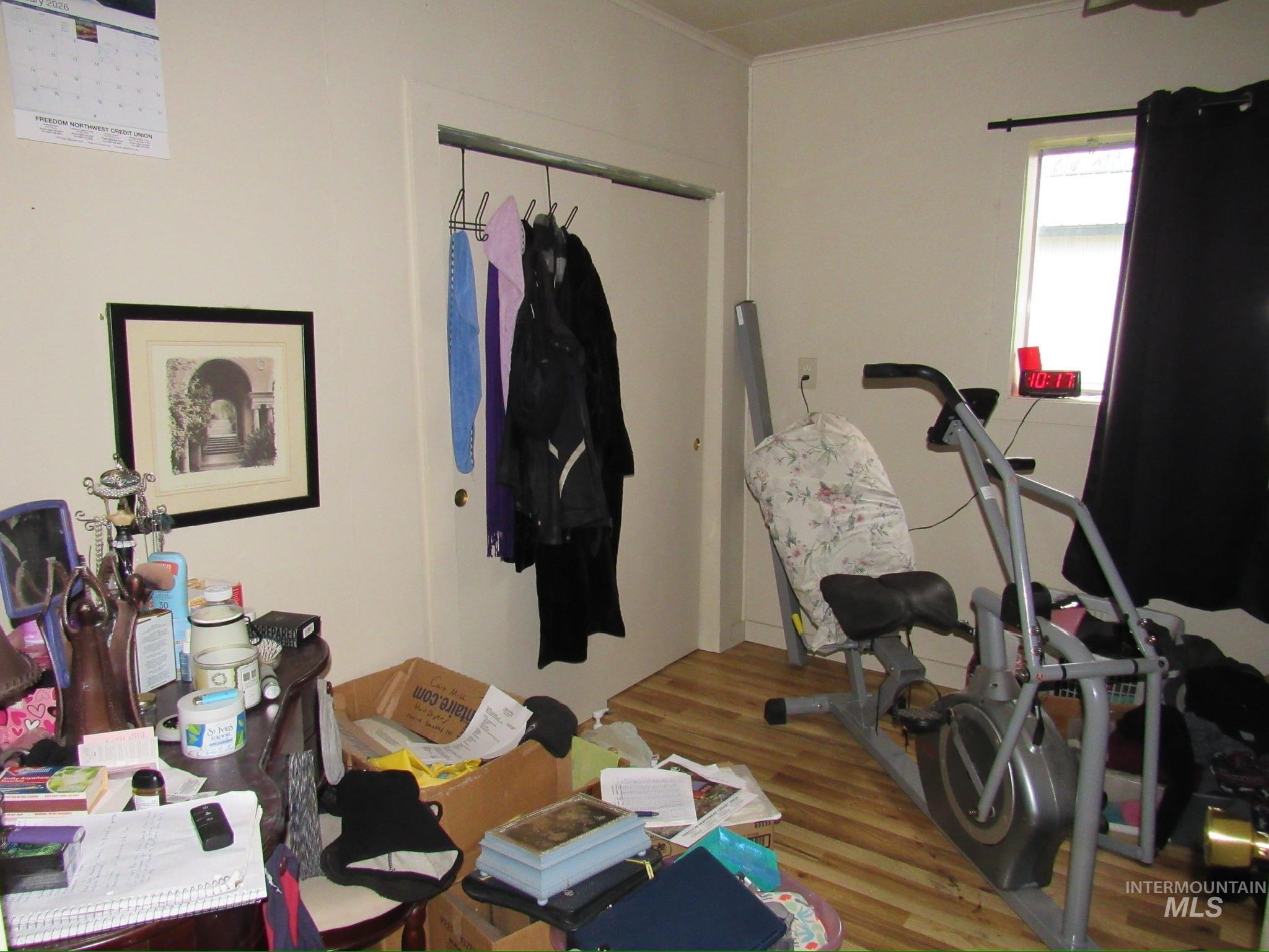 317 Esther Street Kooskia, ID 83539 - Photo 15 of 15 Exercise area with wood finished floors and crown molding