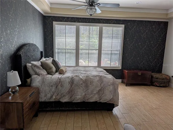 a bedroom with a bed and window