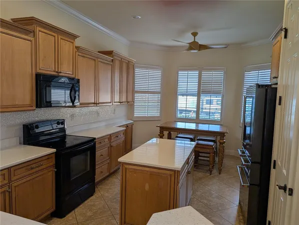 a kitchen with a sink stove and refrigerator