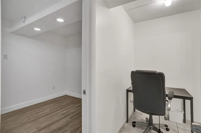a view of workspace with wooden floor
