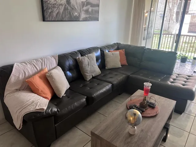 a living room with furniture and a couch