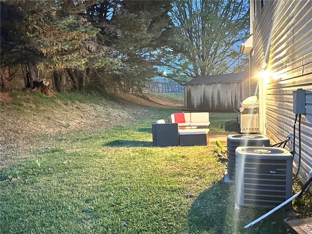 225 Lee Court Canton, GA 30115 - Photo 18 of 18 a view of a back yard of the house and a yard