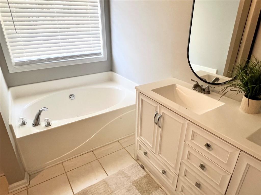 225 Lee Court Canton, GA 30115 - Photo 10 of 18 a bathroom with a sink and a mirror