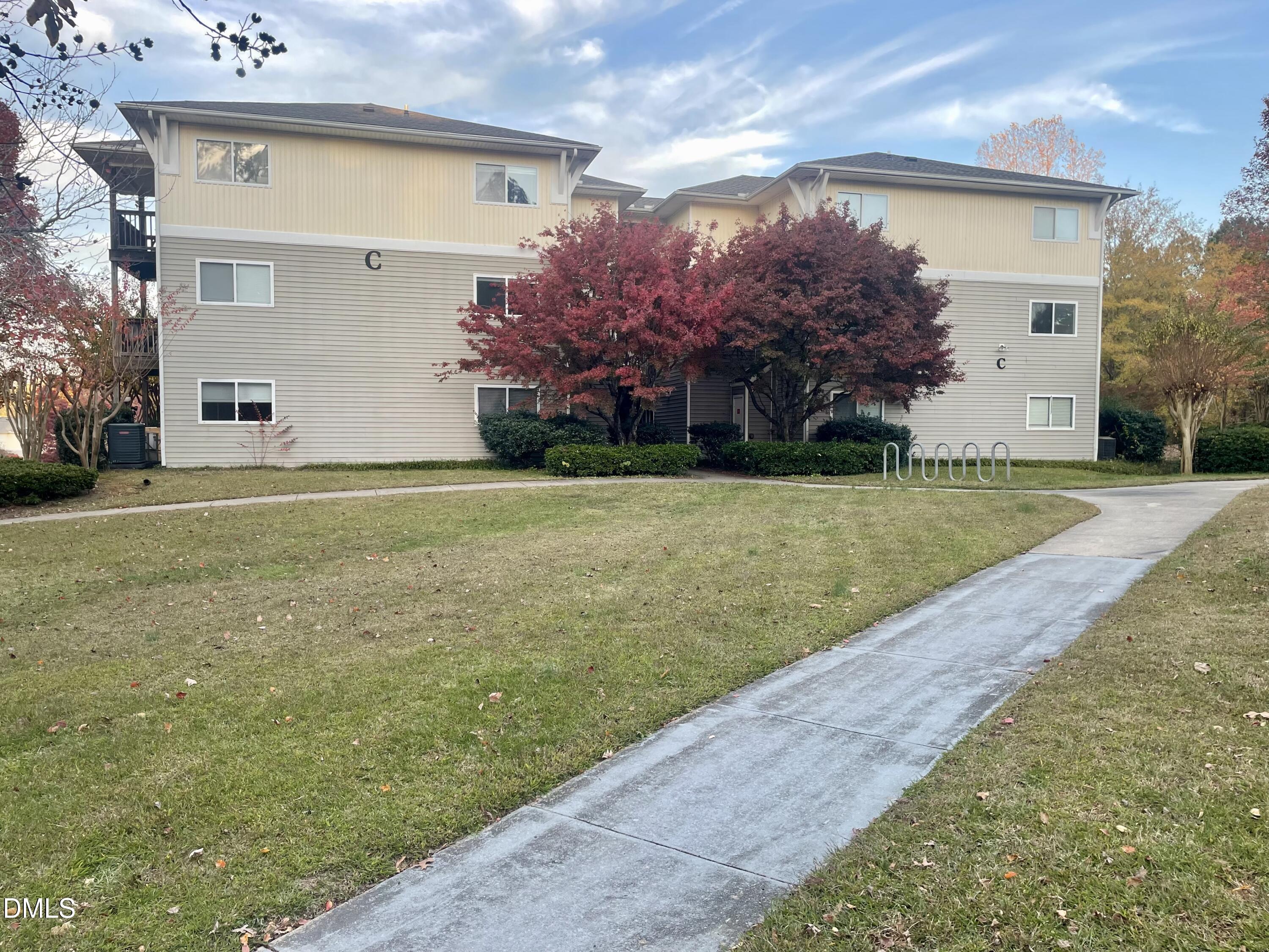 303 Smith Level Road, Unit C12 Chapel Hill, NC 27516 - Photo 1 of 18 a front view of house with yard and trees