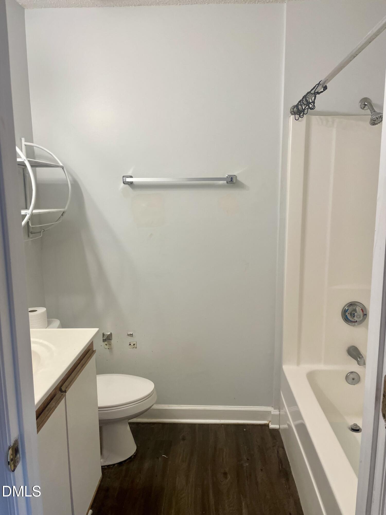 303 Smith Level Road, Unit C12 Chapel Hill, NC 27516 - Photo 11 of 18 a bathroom with a sink a toilet and shower